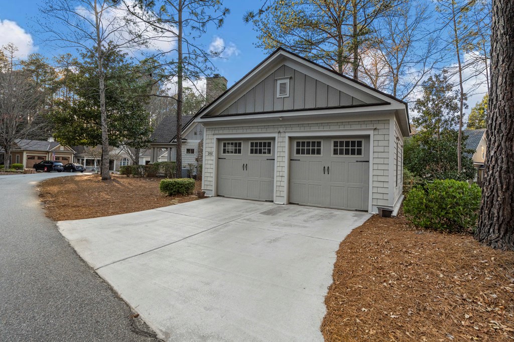 202 White Oak Road Pine Mountain, GA 31822 - Photo 17 of 70 a front view of a house with a yard and garage