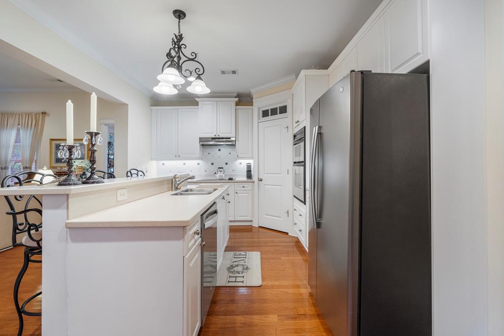 202 White Oak Road Pine Mountain, GA 31822 - Photo 27 of 70 a kitchen with stainless steel appliances a refrigerator and a chandelier