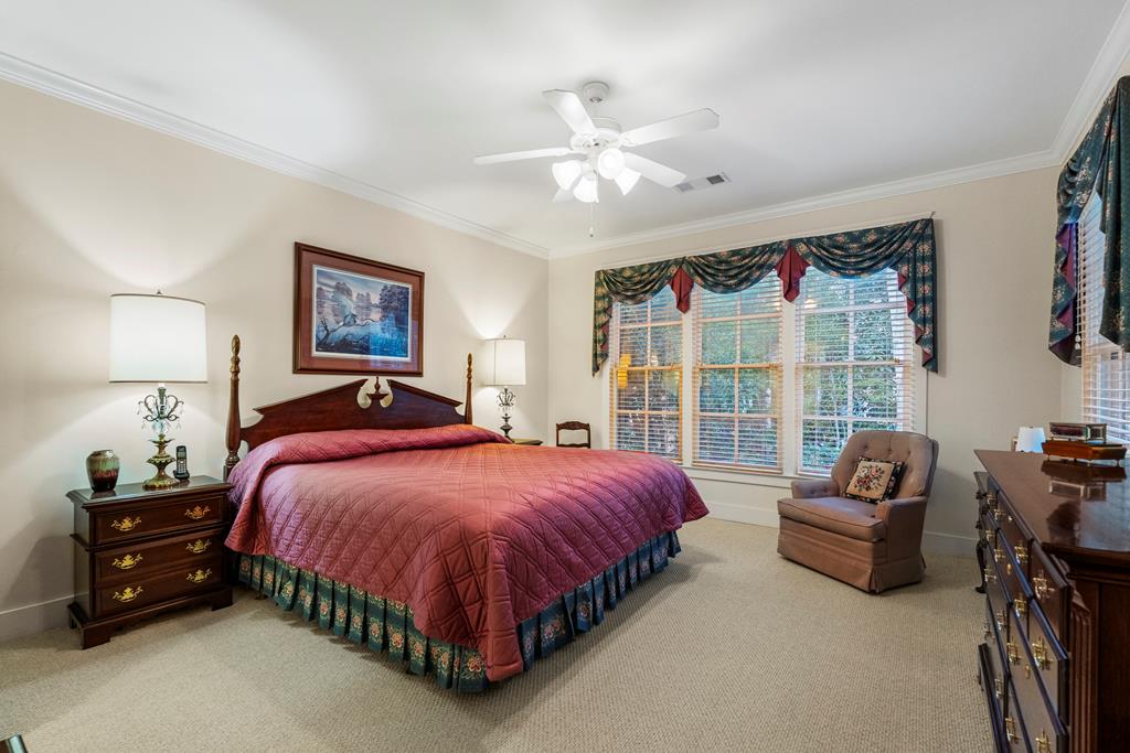 202 White Oak Road Pine Mountain, GA 31822 - Photo 30 of 70 a spacious bedroom with a bed a couch and a large window