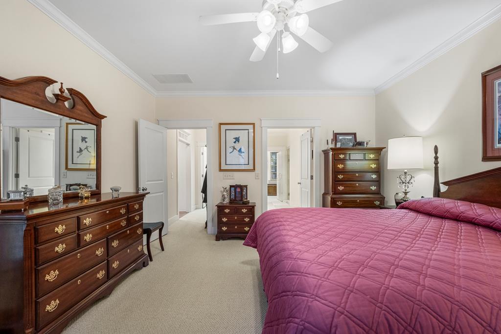 202 White Oak Road Pine Mountain, GA 31822 - Photo 31 of 70 a bedroom with a bed and dresser with mirror