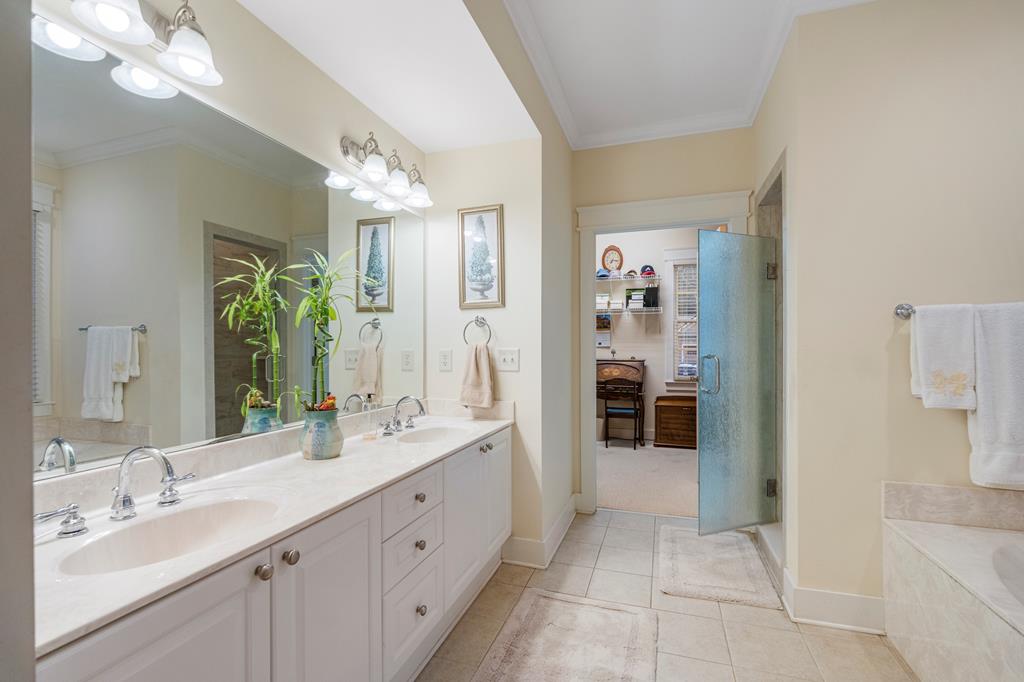 202 White Oak Road Pine Mountain, GA 31822 - Photo 32 of 70 a spacious bathroom with a double vanity sink a large mirror and a shower
