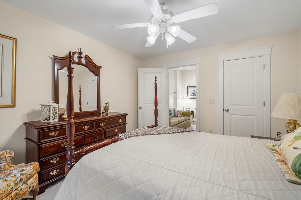 202 White Oak Road Pine Mountain, GA 31822 - Photo 39 of 70 a bedroom with a bed and a chandelier