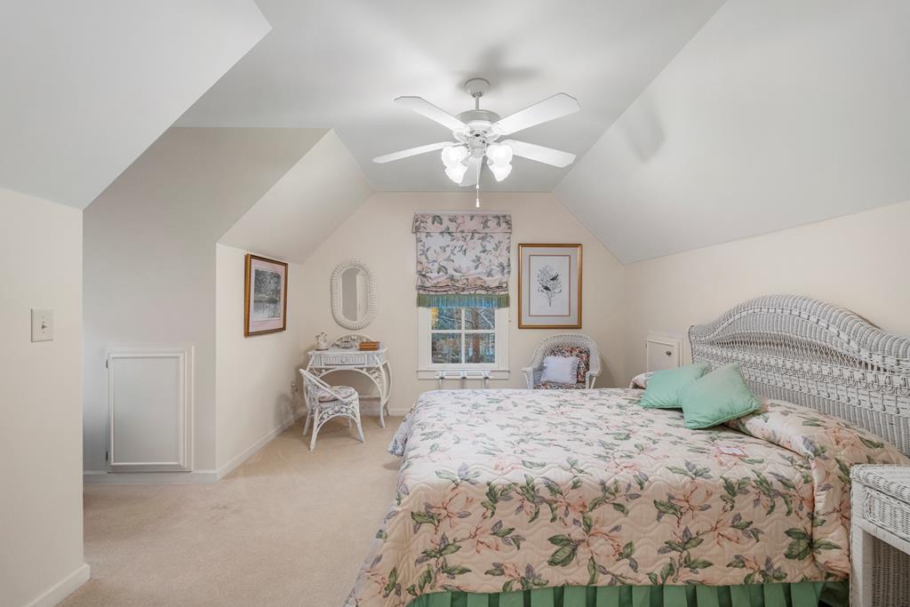 202 White Oak Road Pine Mountain, GA 31822 - Photo 40 of 70 a bedroom with a large bed and ceiling fan