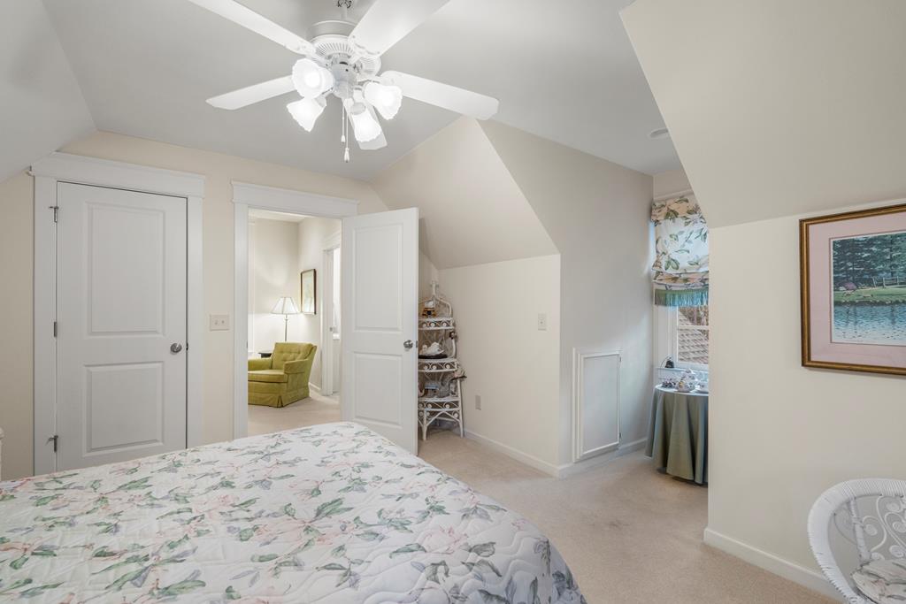 202 White Oak Road Pine Mountain, GA 31822 - Photo 41 of 70 a bedroom with a bed and a chandelier