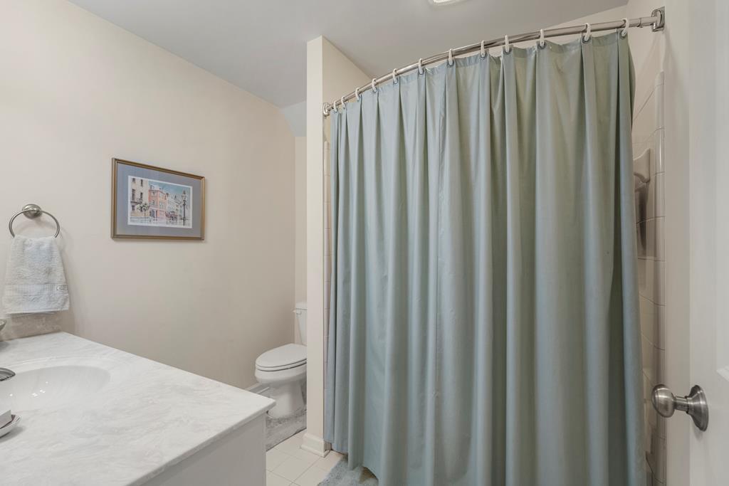 202 White Oak Road Pine Mountain, GA 31822 - Photo 42 of 70 a bathroom with a shower curtain and sink