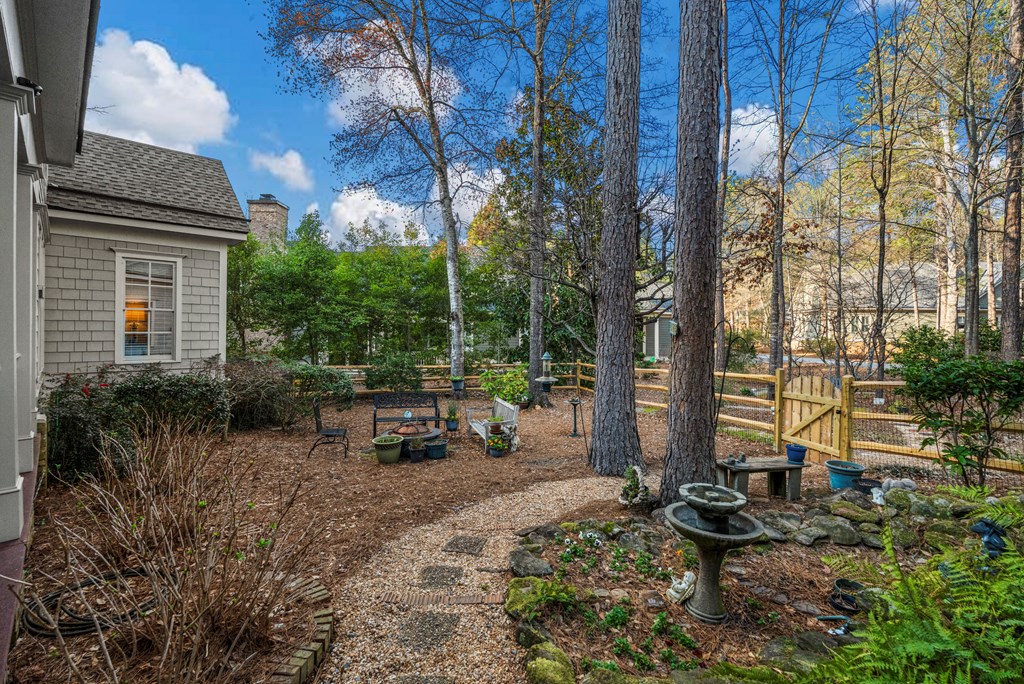 202 White Oak Road Pine Mountain, GA 31822 - Photo 7 of 70 a view of backyard with a table and chairs and potted plants