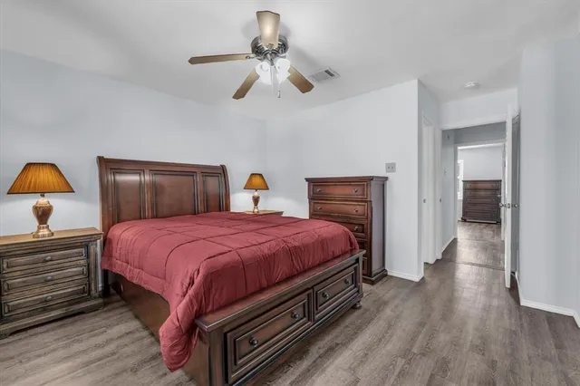 a bed room with a bed and a chandelier
