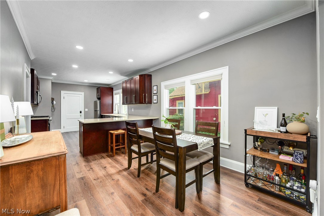 7408-7410 Rutledge Avenue Cleveland, OH 44102 - Photo 8 of 46 Dining space with ornamental molding and hardwood / wood-style flooring