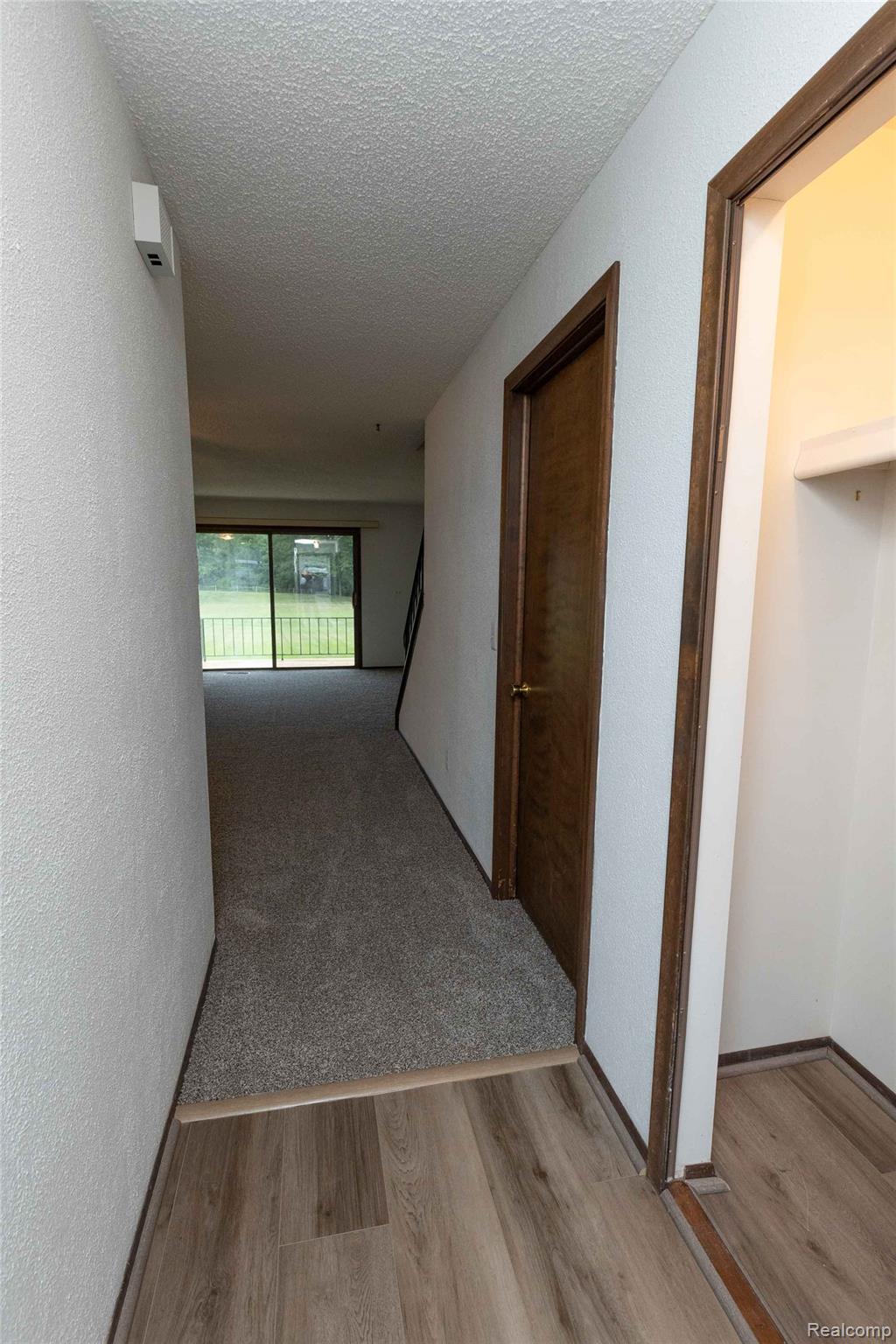 125 Cuttle Road Marysville, MI 48040 - Photo 11 of 44 Wood-finish flooring transitions to carpeting