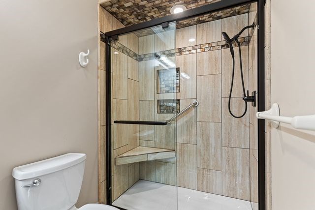1190 Maple Grove Road Morganton, GA 30560 - Photo 68 of 96 a bathroom with a shower a toilet and sink