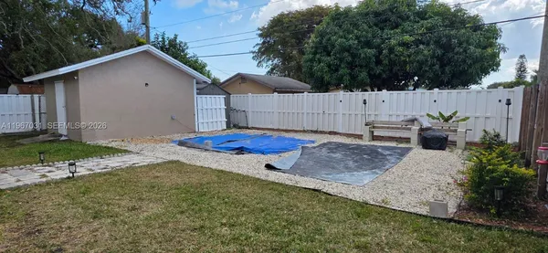 a view of backyard with green space