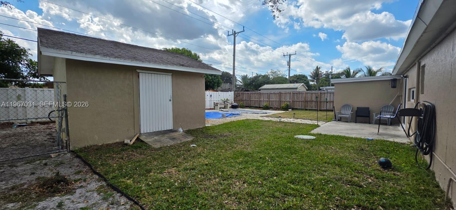 5900 Atlanta Street Hollywood, FL 33021 - Photo 21 of 21 a view of a backyard with a garden