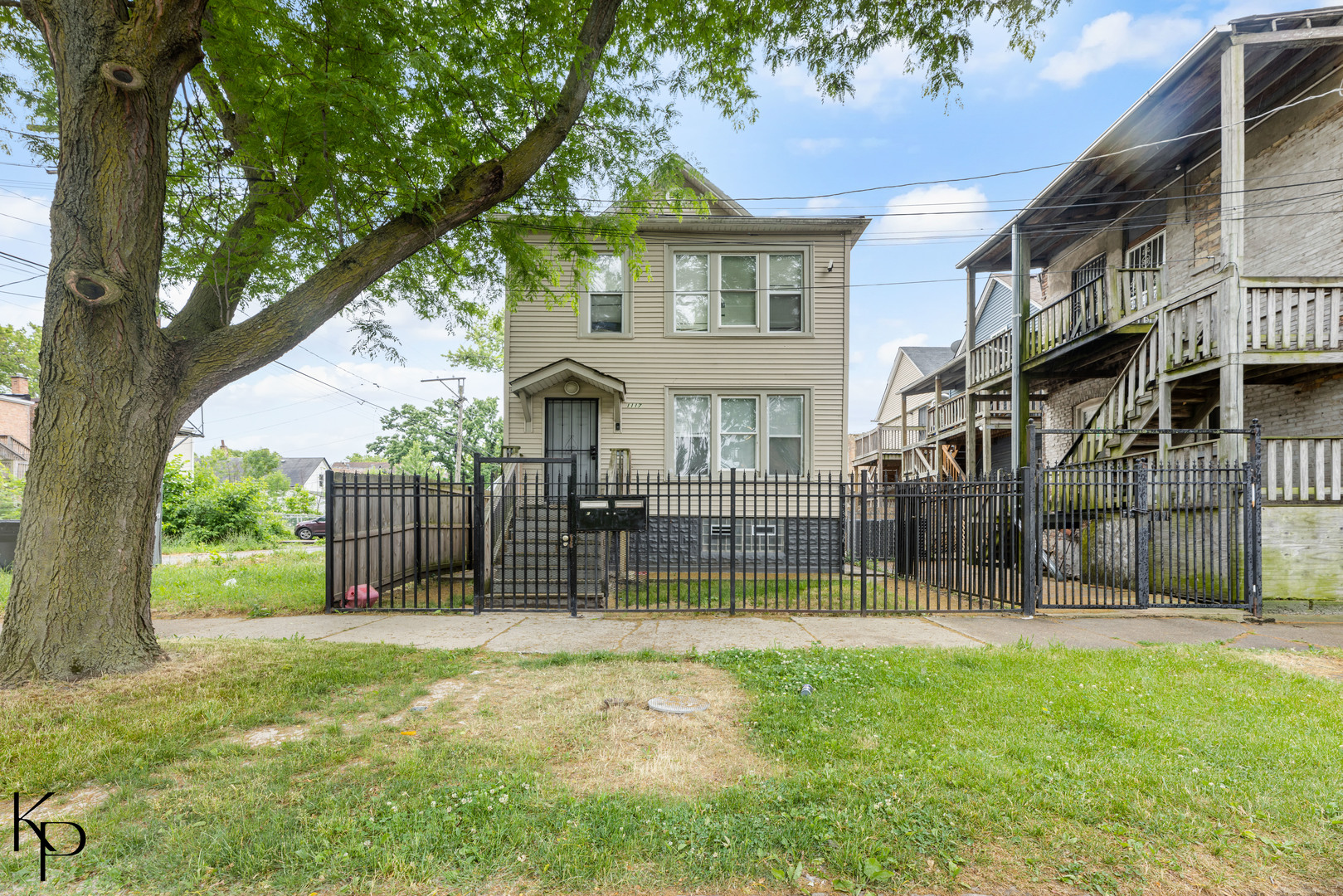 a view of house with a yard