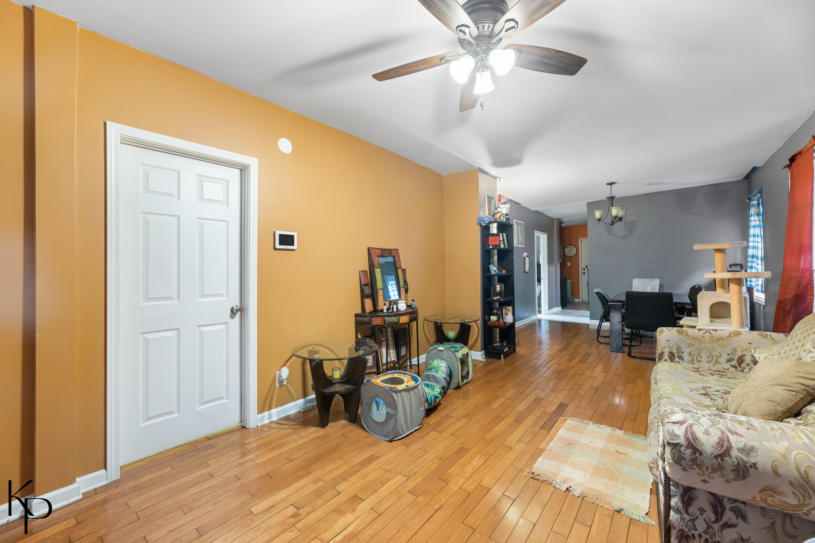 1117 West 57th Street Chicago, IL 60621 - Photo 2 of 9 a bed room with a bed and a ceiling fan
