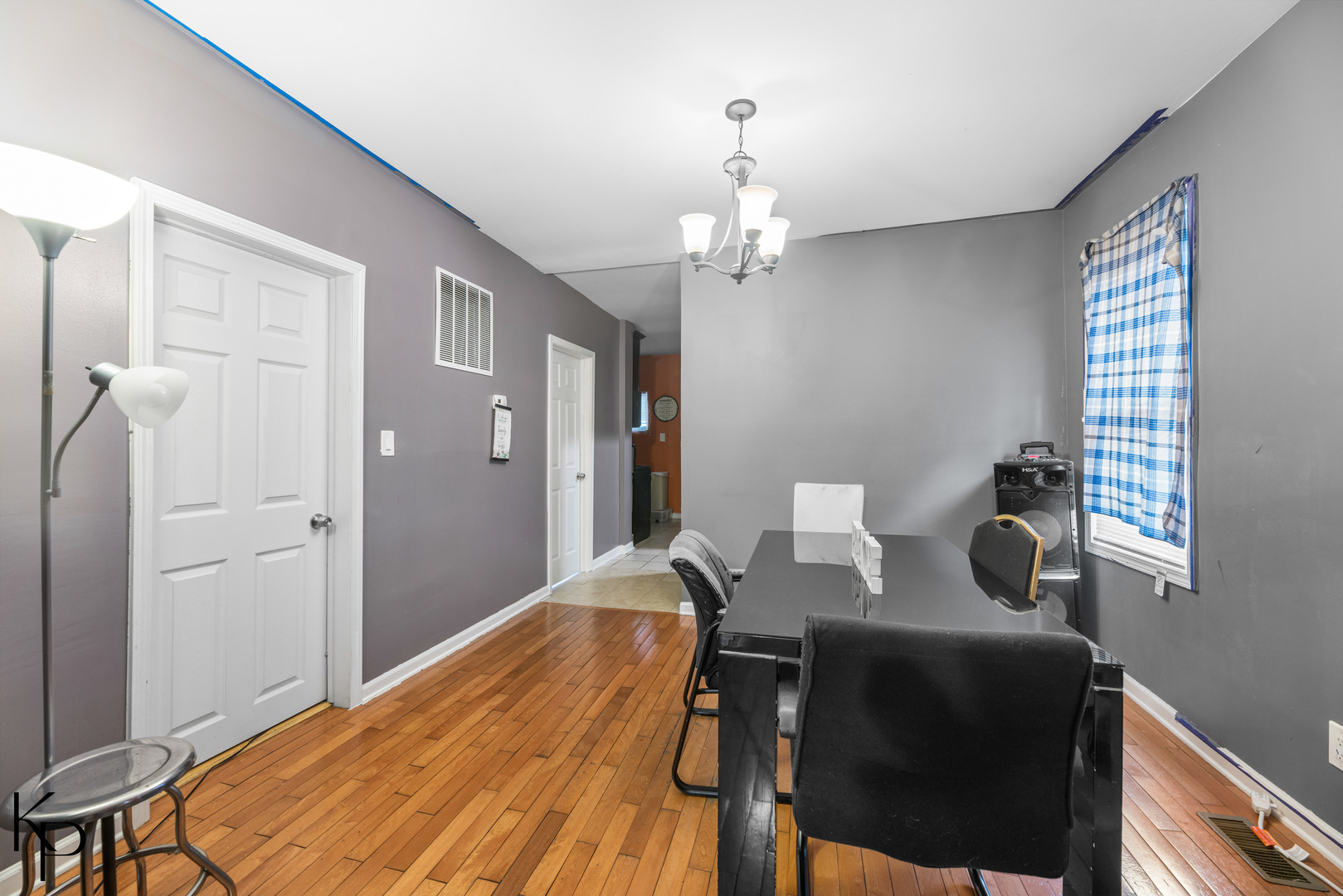 1117 West 57th Street Chicago, IL 60621 - Photo 3 of 9 a view of a dining room with furniture and wooden floor