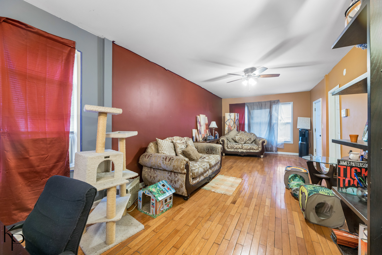 1117 West 57th Street Chicago, IL 60621 - Photo 5 of 9 a living room with furniture and a wooden floor