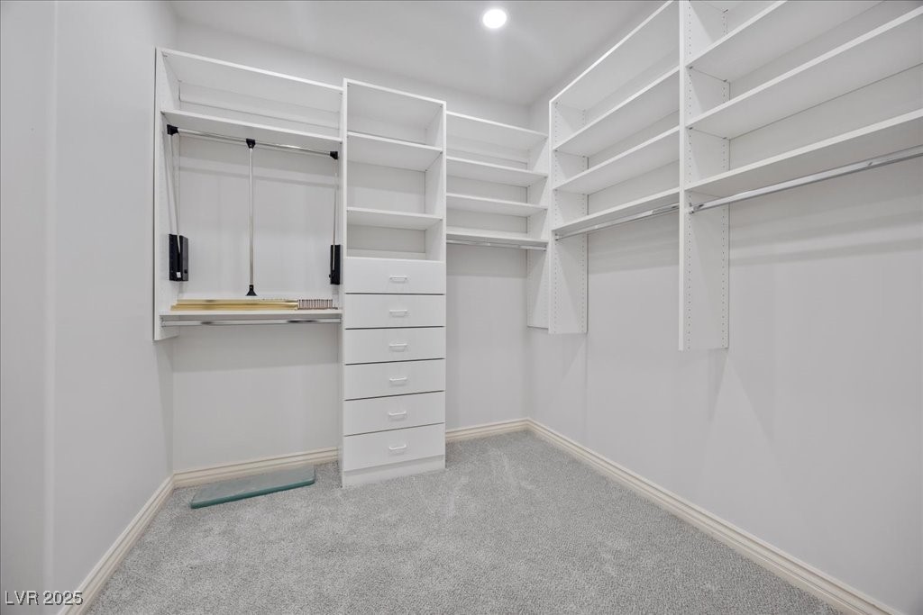 640 Quail Covey Road Henderson, NV 89002 - Photo 14 of 75 Primary Bedroom Walk in closet with carpet
