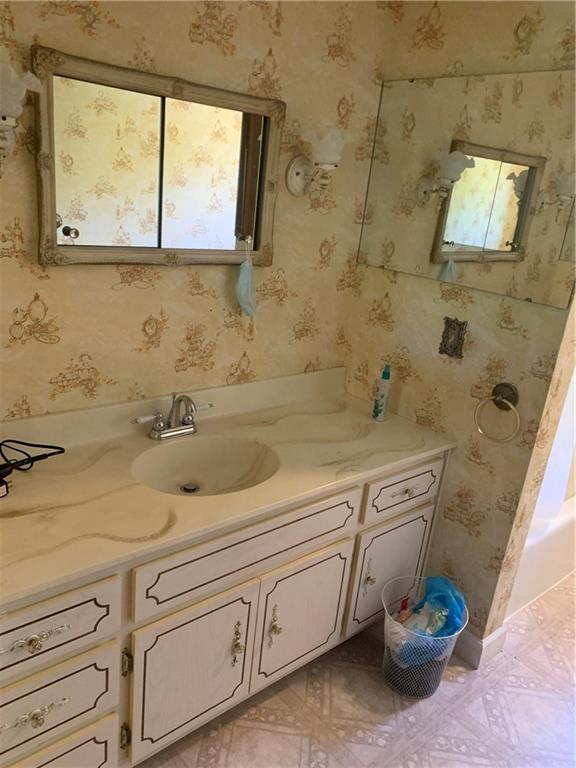 801 Beaver Road Greensburg, PA 15601 - Photo 12 of 20 a bathroom with a sink a toilet and a window