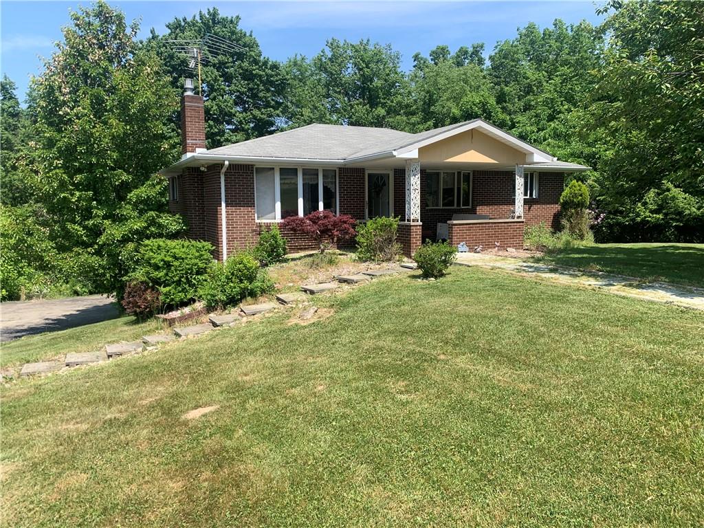 801 Beaver Road Greensburg, PA 15601 - Photo 2 of 20 a front view of a house with garden