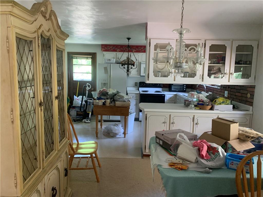 801 Beaver Road Greensburg, PA 15601 - Photo 7 of 20 a living room with furniture fireplace and a chandelier
