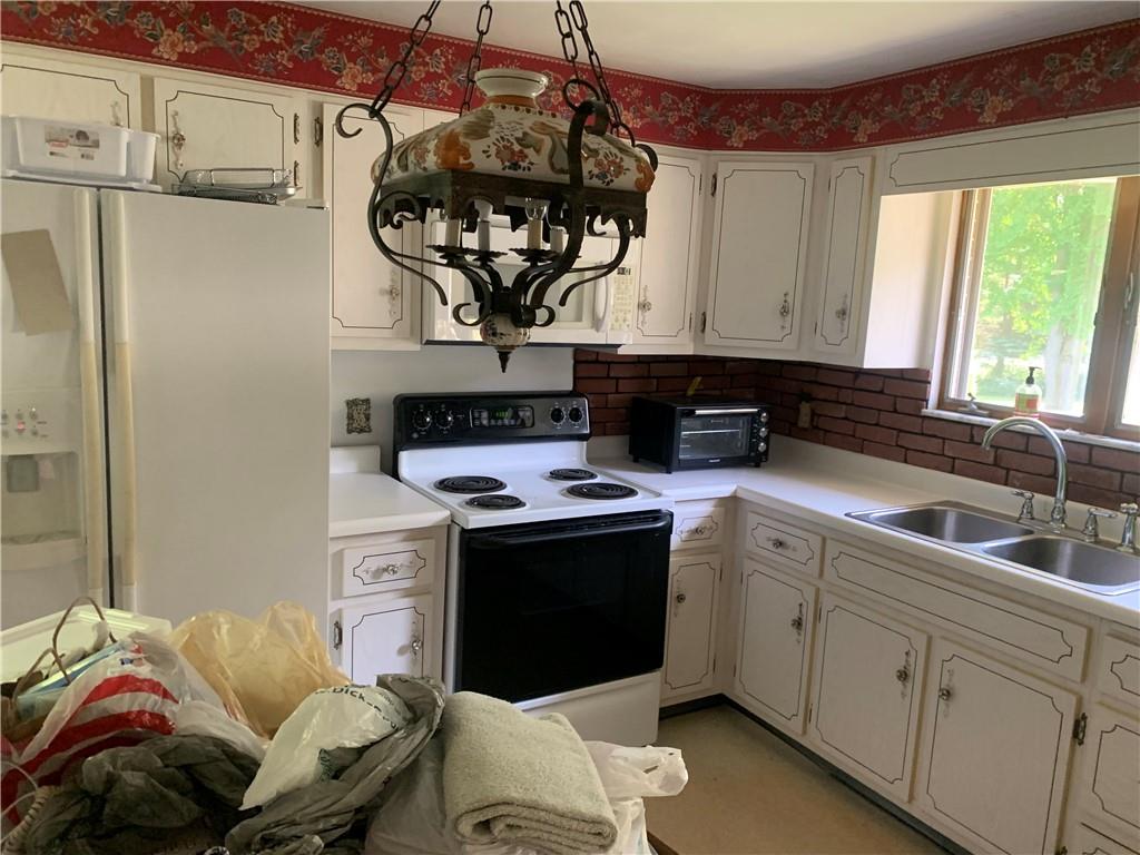 801 Beaver Road Greensburg, PA 15601 - Photo 9 of 20 a kitchen with a stove and a sink