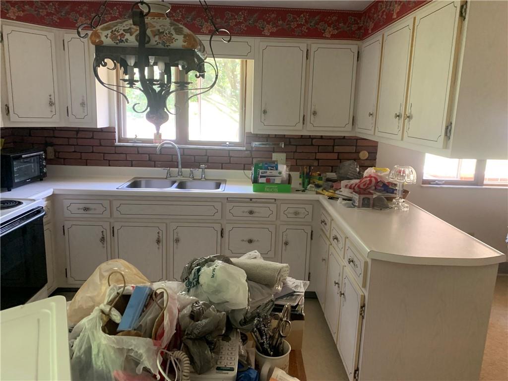 801 Beaver Road Greensburg, PA 15601 - Photo 10 of 20 a kitchen with a sink a stove and cabinets