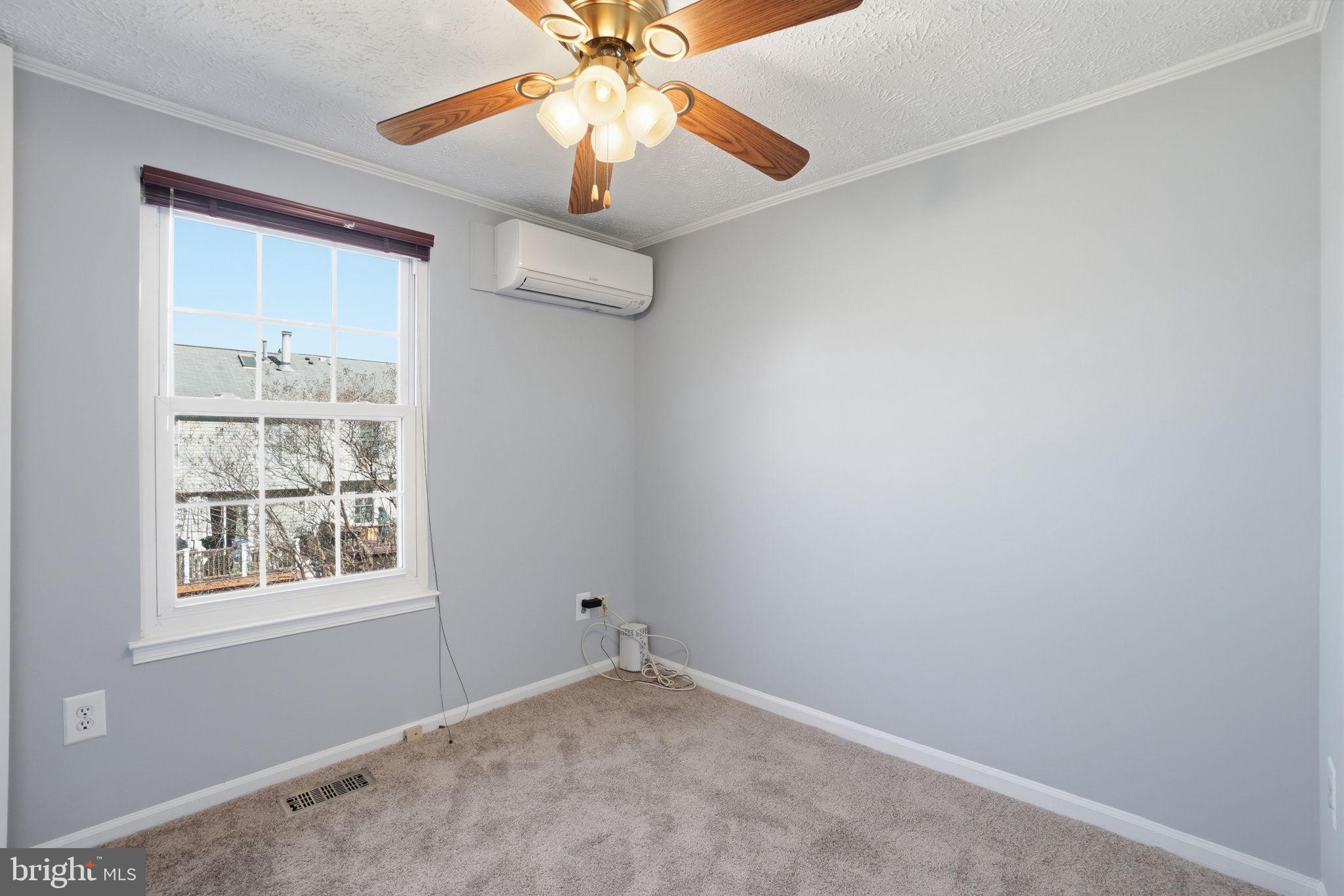 7470 Wounded Knee Road Lorton, VA 22079 - Photo 14 of 24 an empty room with windows and fan