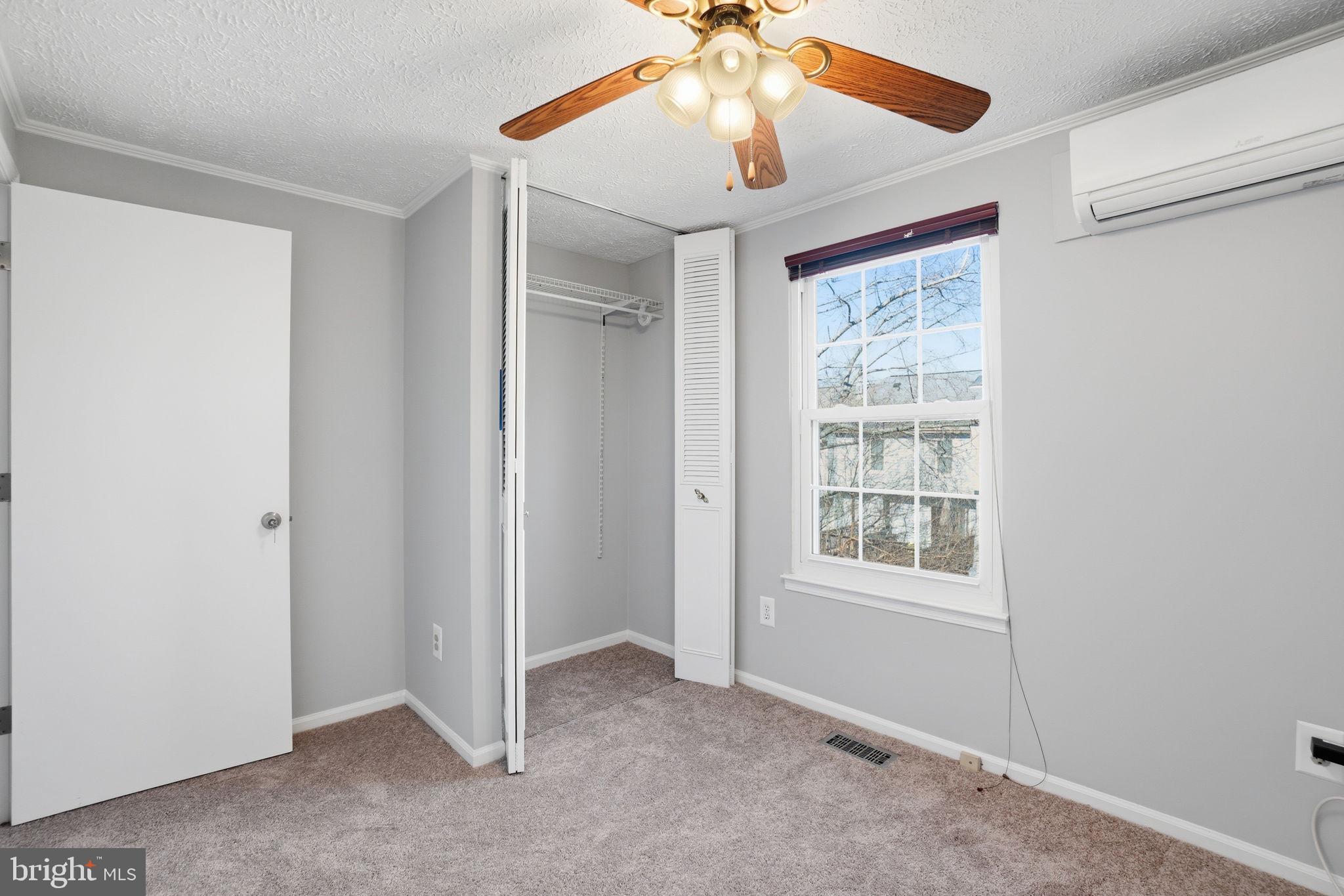 7470 Wounded Knee Road Lorton, VA 22079 - Photo 15 of 24 an empty room with windows and fan
