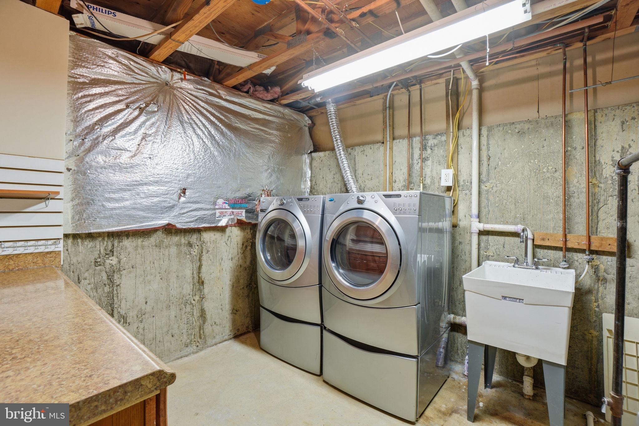 7470 Wounded Knee Road Lorton, VA 22079 - Photo 19 of 24 a utility room with dryer and washer