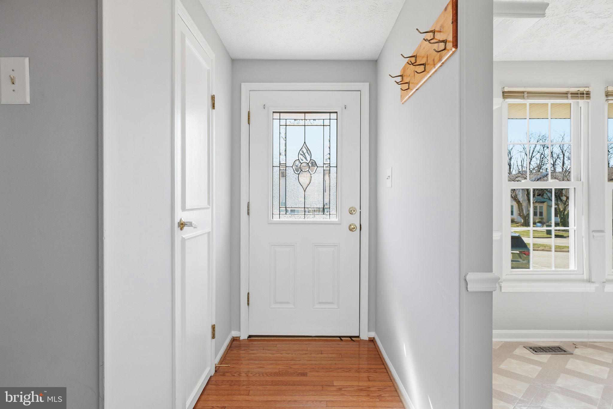 7470 Wounded Knee Road Lorton, VA 22079 - Photo 2 of 24 a view of a hallway with windows