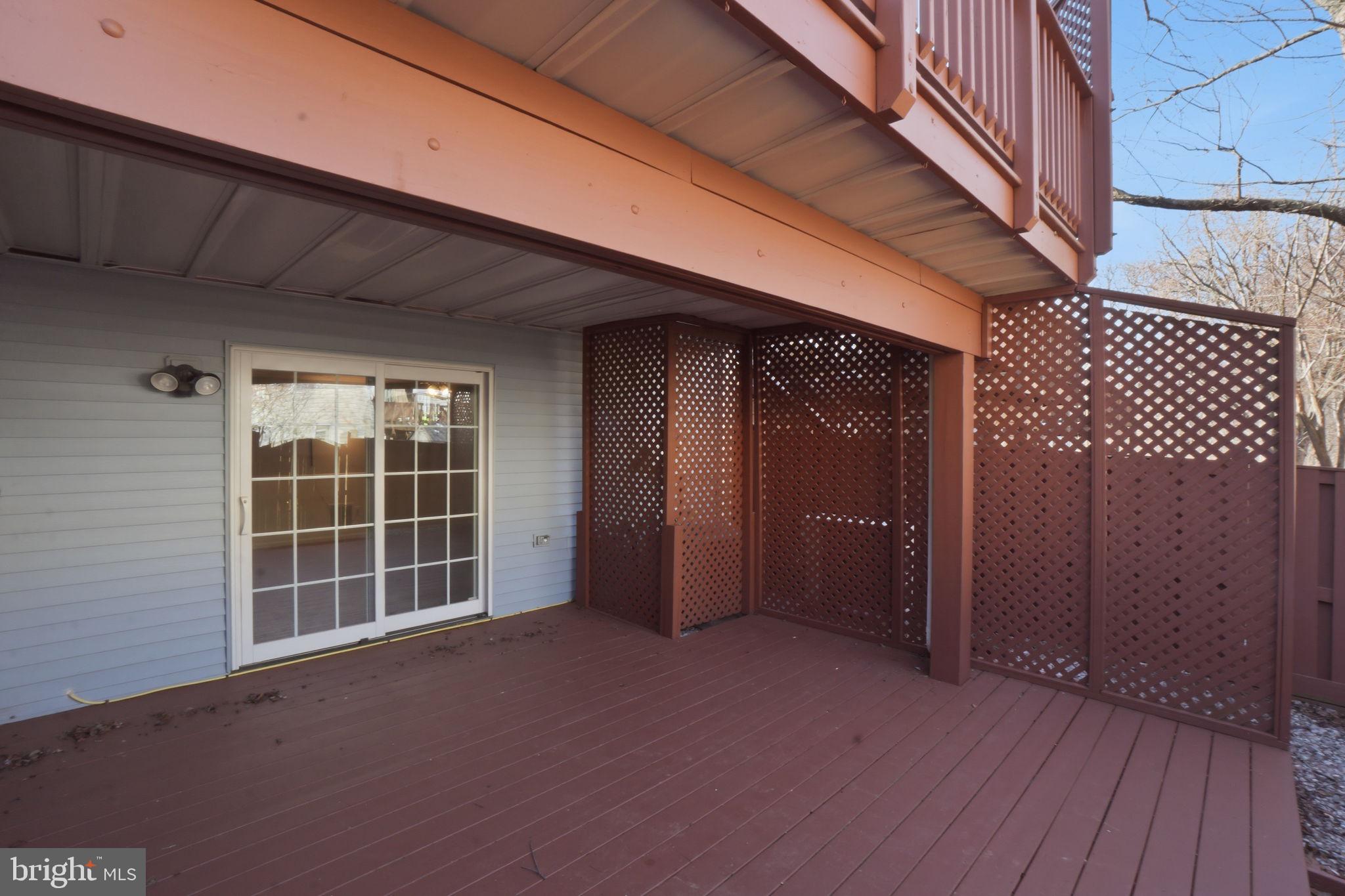 7470 Wounded Knee Road Lorton, VA 22079 - Photo 23 of 24 a view of an empty room with wooden floor and a window