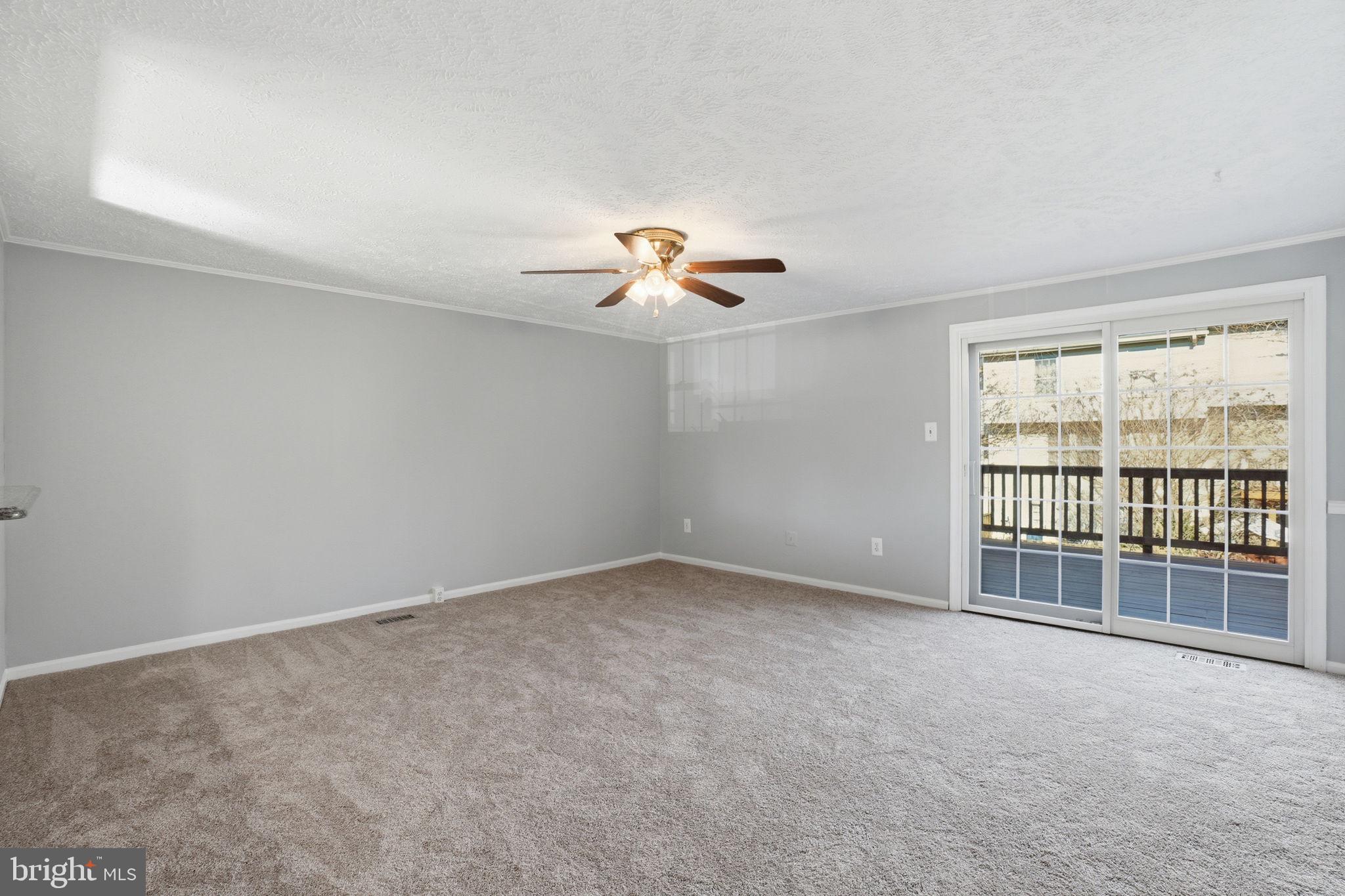 7470 Wounded Knee Road Lorton, VA 22079 - Photo 7 of 24 a view of an empty room with a window
