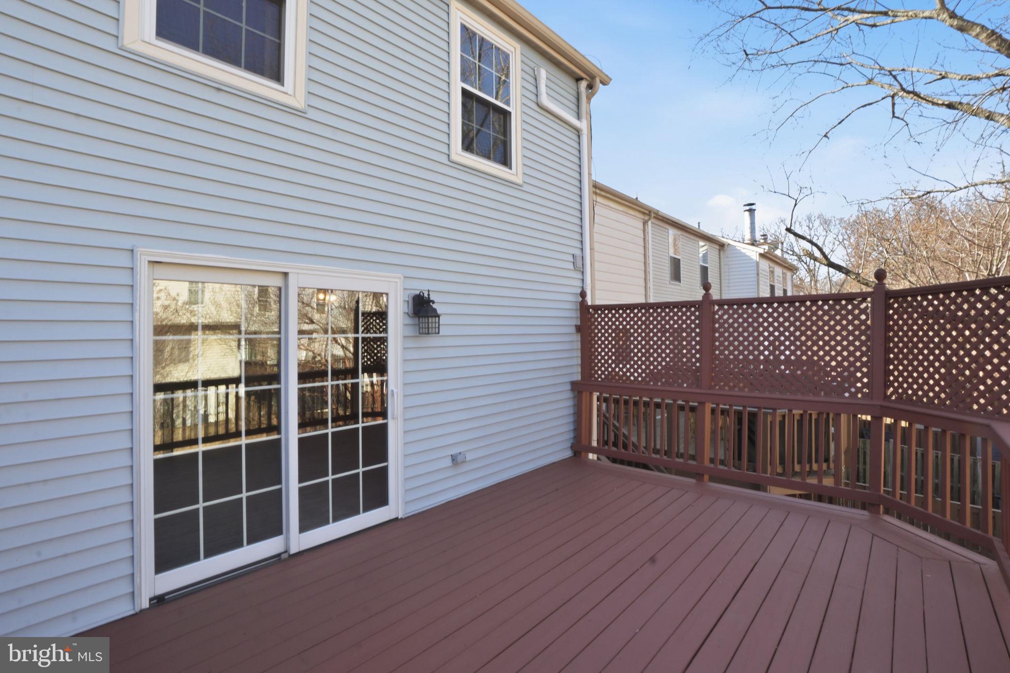 7470 Wounded Knee Road Lorton, VA 22079 - Photo 9 of 24 a view of a deck with wooden floor and fence