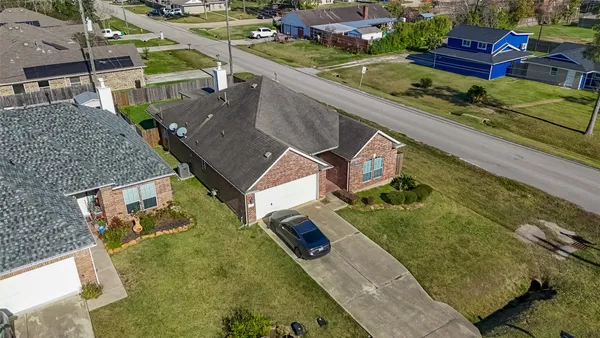 an aerial view of a house with a garden
