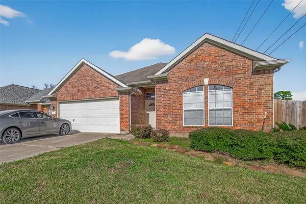 a front view of a house with garage