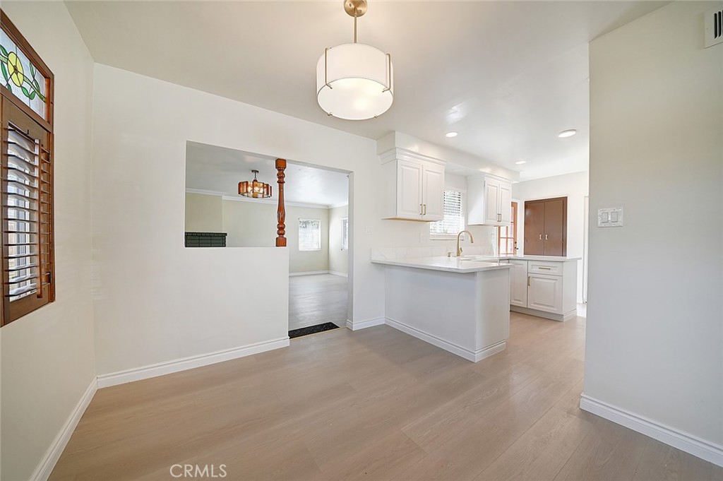9118 Maple Street Bellflower, CA 90706 - Photo 17 of 74 a view of a kitchen cabinets and a kitchen