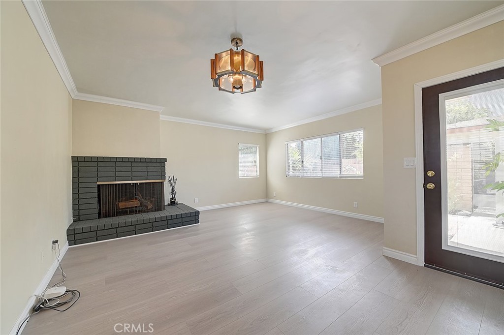 9118 Maple Street Bellflower, CA 90706 - Photo 26 of 74 an empty room with windows and fireplace