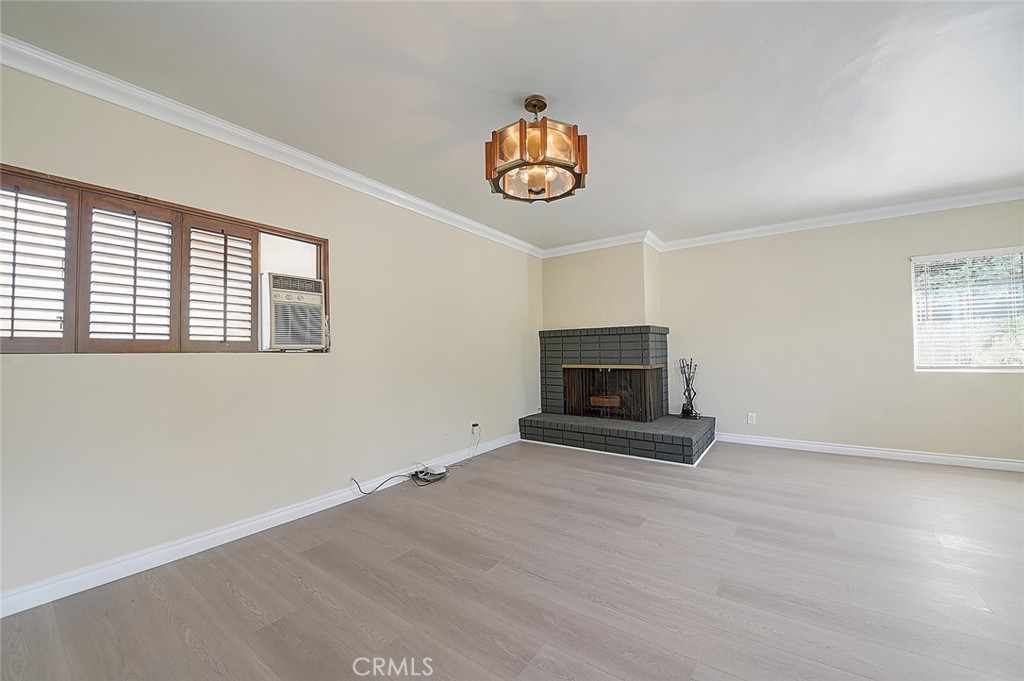 9118 Maple Street Bellflower, CA 90706 - Photo 27 of 74 an empty room with windows and fireplace