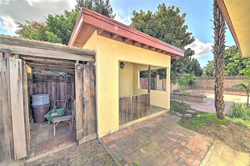 9118 Maple Street Bellflower, CA 90706 - Photo 59 of 74 a view of a house with backyard and porch
