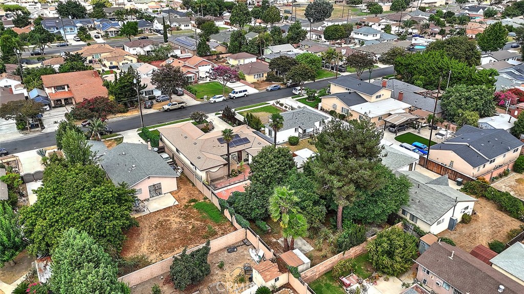 9118 Maple Street Bellflower, CA 90706 - Photo 66 of 74 an aerial view of residential houses with outdoor space
