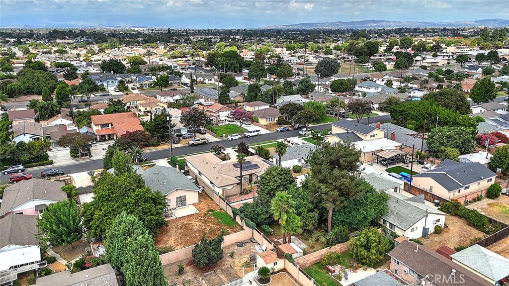 9118 Maple Street Bellflower, CA 90706 - Photo 69 of 74 an aerial view of residential houses with outdoor space