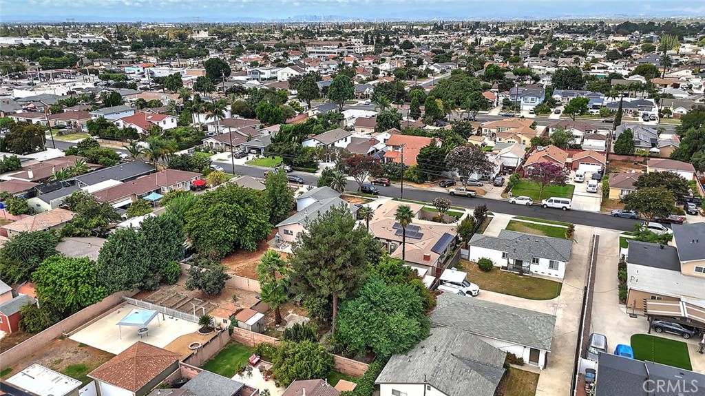 9118 Maple Street Bellflower, CA 90706 - Photo 70 of 74 an aerial view of residential houses with city view