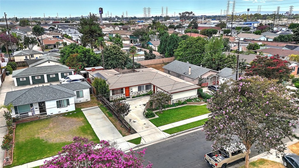 9118 Maple Street Bellflower, CA 90706 - Photo 7 of 74 an aerial view of residential houses with yard