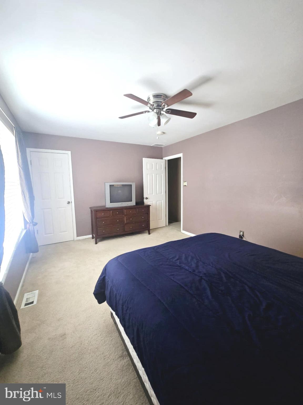 3505 Tall Pines Pine Hill, NJ 08021 - Photo 8 of 10 a bedroom with a bed and a chandelier