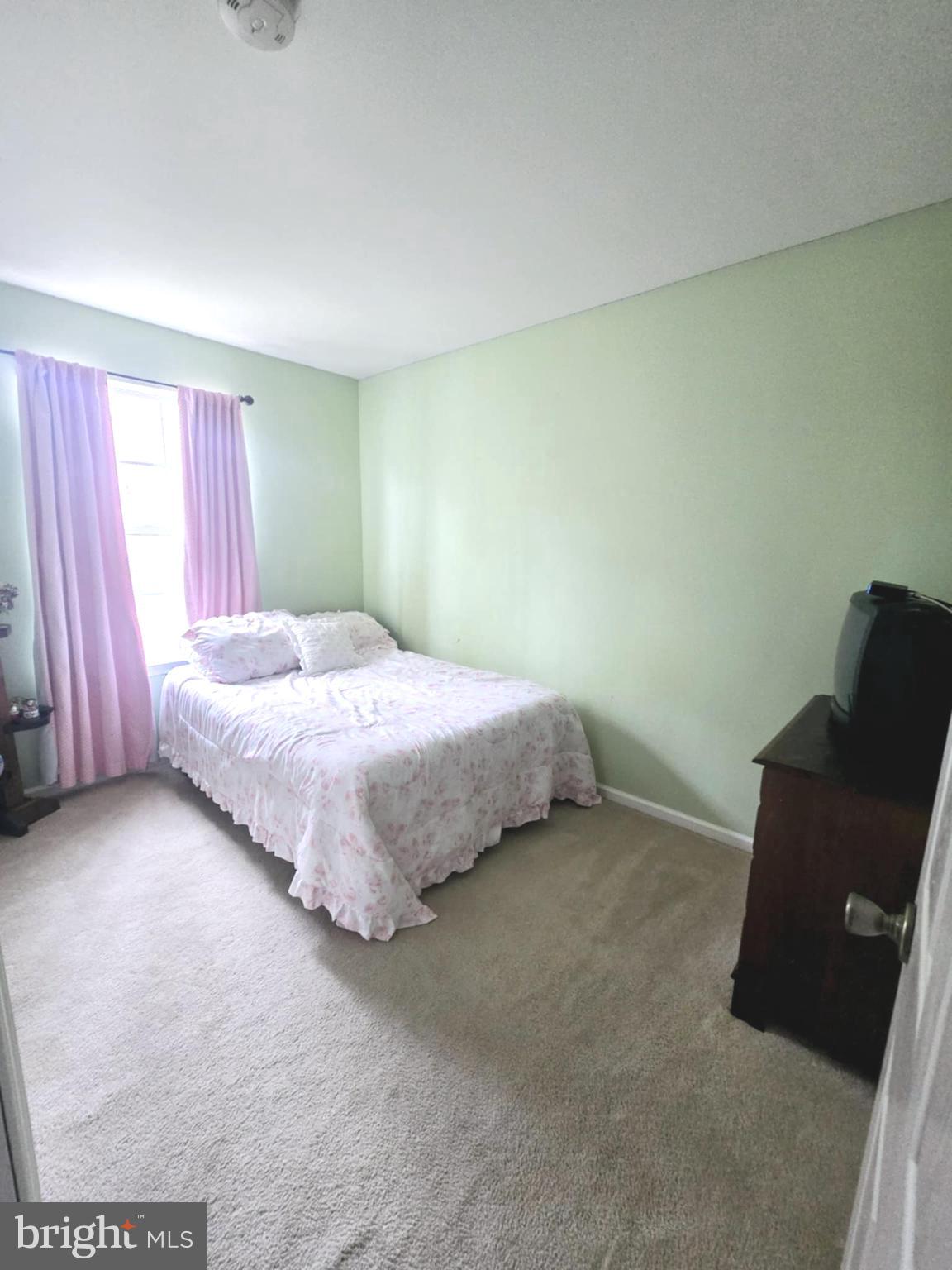 3505 Tall Pines Pine Hill, NJ 08021 - Photo 9 of 10 a bedroom with a bed and a chair