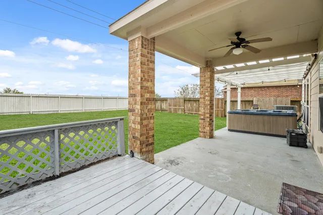 a view of a porch with wooden floor and outdoor space