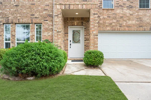front view of a house with garden