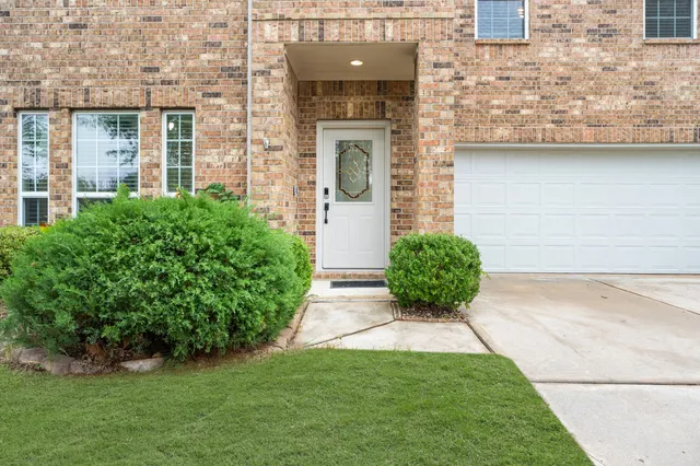 front view of a house with garden
