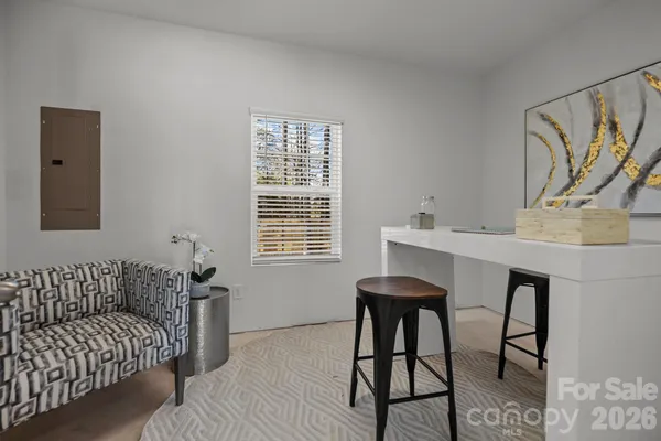 a workspace with furniture and window