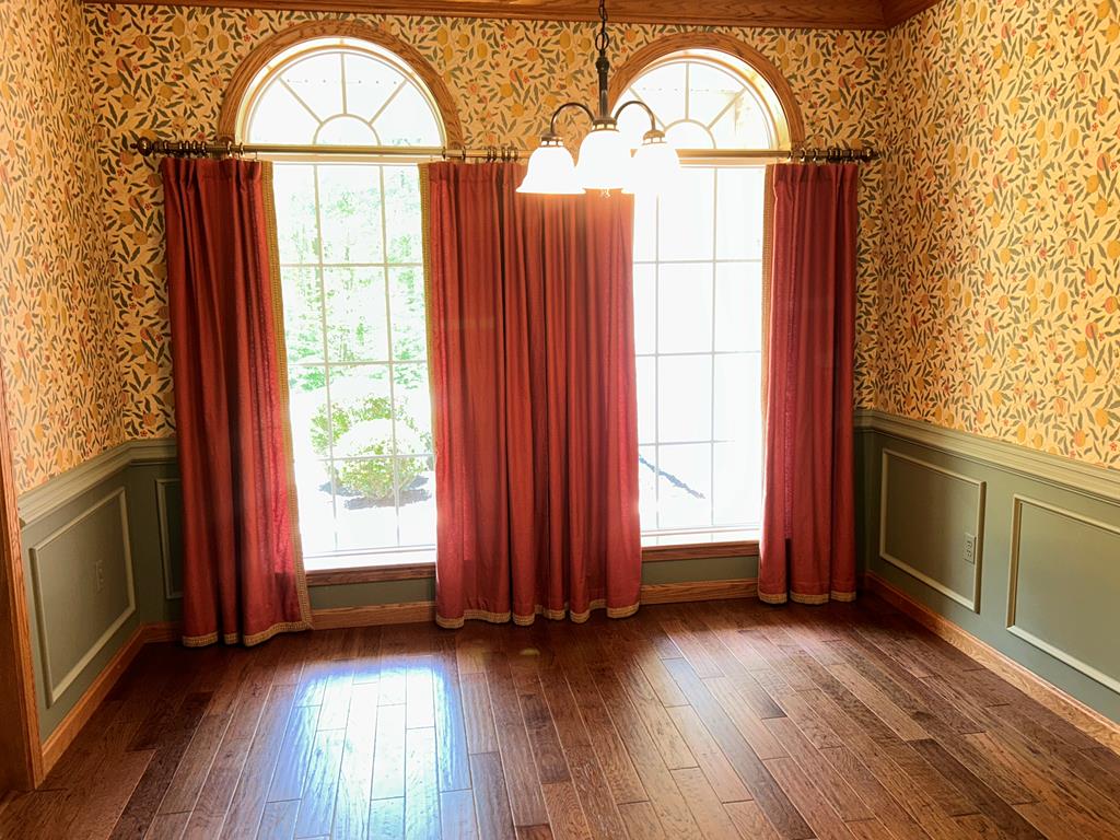 114 Oak Ridge Drive Clarion, PA 16214 - Photo 15 of 38 an empty room with wooden floor fan and windows